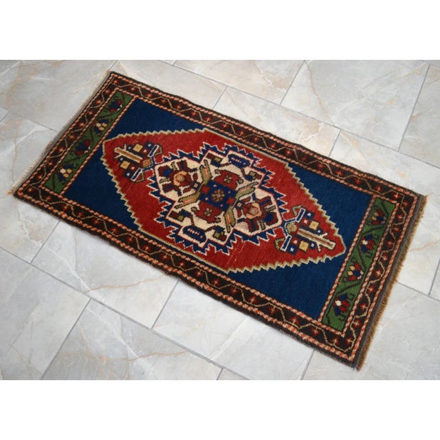 a Vintage Turkish Small yastik rug, blue background yastik rug perfect for entryway, bath or in front of the kitchen sink....