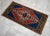 a Vintage Turkish Small yastik rug, blue background yastik rug perfect for entryway, bath or in front of the kitchen sink....