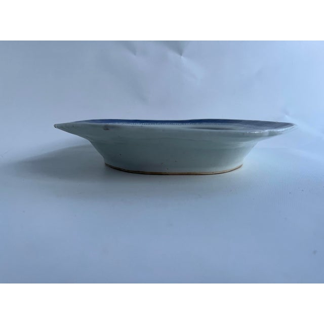 A single large antique Chinese porcelain footed serving platter featuring cobalt decoration in the Canton pattern.