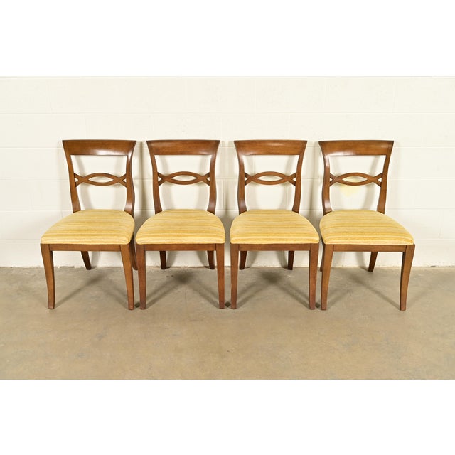 A gorgeous set of four Regency style dining chairs In the manner of Kindel Furniture USA, Circa 1960s Carved walnut...