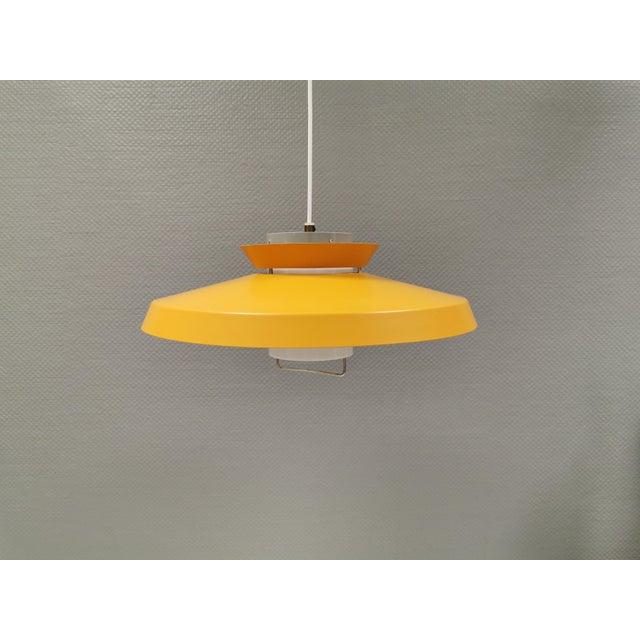 EXTREMELY rare Lyfa hanging lamp by Bent Karlby Denmark 1960s. In original yellow/curry colored lacquered metal upper...