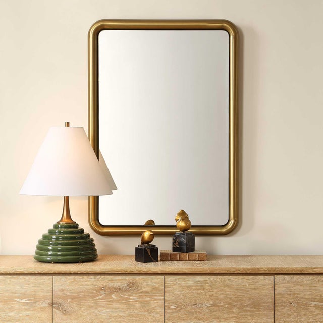 This Sleek Rectangular Mirror Features A Contemporary Design With A Softly Rounded Stainless-steel Frame, All Finished In...