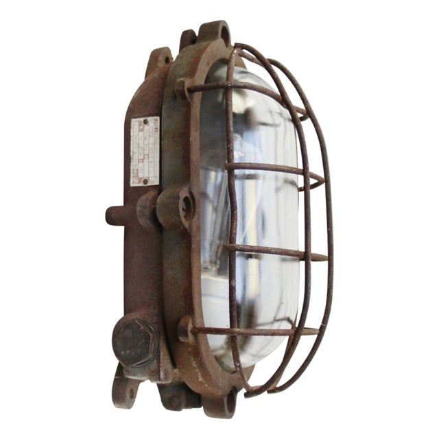Sconce in Rust Cast Iron and Clear Glass For Sale