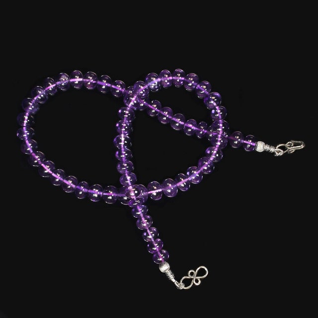 This exquisite 18‑inch glowing transparent amethyst necklace is designed to bring a touch of refined beauty to any jewelry...