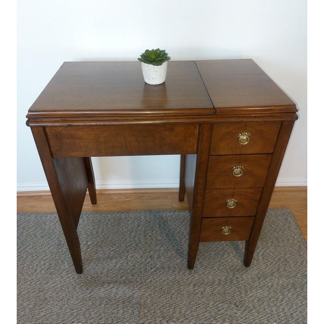 Beautiful vintage Sears Kenmore Model 158.17560 sewing machine housed in its original folding wood cabinet. The cabinet...