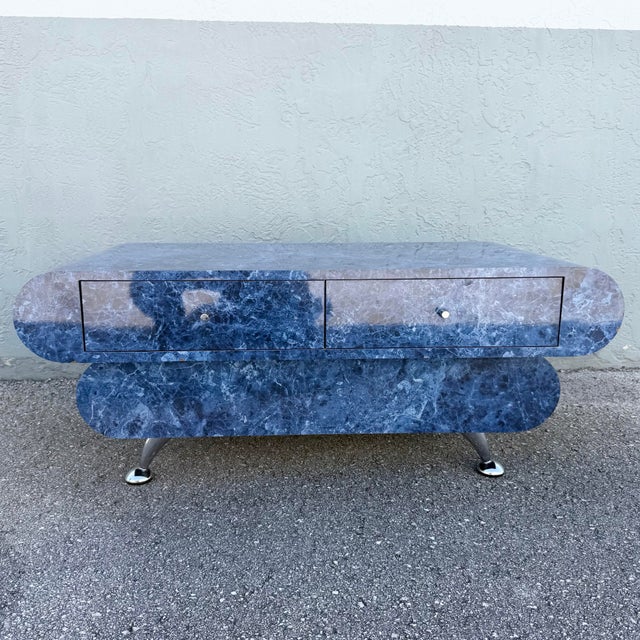 Bold Postmodern coffee table featuring a dramatic faux blue marble finish with swirling navy, cobalt, gray, and white...