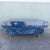 Bold Postmodern coffee table featuring a dramatic faux blue marble finish with swirling navy, cobalt, gray, and white...