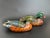 A vintage pair of Wood Duck artisan decoys, consisting of a drake and a hen. Hand carved and hand painted with bold hues...