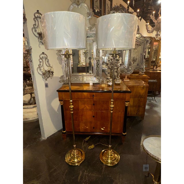 These floor lamps are crafted from heavy English silvered bronze, adding a touch of elegance and sophistication to any...
