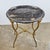 A French, 2nd Empire, gilded table base featuring cast eagles, holding a beautiful Nero Portoro marble tray.