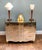 A stylish Art Deco mirrored chest of drawers dating to the 1930s, featuring a gently serpentine front and entirely clad in...