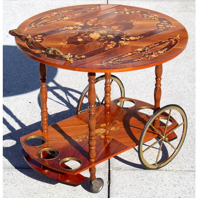 This Italian marquetry inlaid tea cart is a stunning mid-century Sorrento-style bar cart inspired by the renowned...