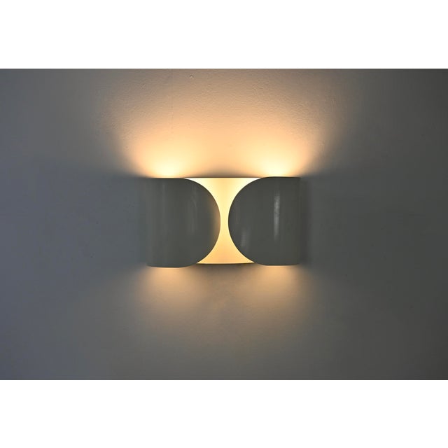 White metal wall sconce by Afra & Tobia Scarpa. Model: Foglio. Stamped Flos. Wear consistent with age and time. This piece...