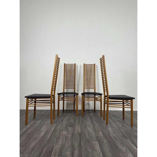 Gorgeous set of four original 1980s dining chairs, featuring the refined ladder back, typical of Italian design of the...