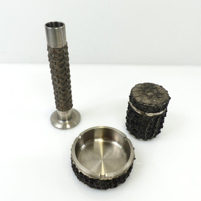 A set of three bmf decorative accessories in a brutalist design characteristic of the 1970s. the trio comprises an...