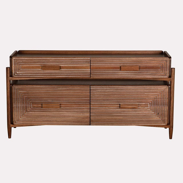 With its sleek form and richly grained walnut finish, the Savino Sideboard embodies the beauty of modern simplicity....