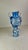 Magnificent and huge vase made of shades of blue glass, a gradient from clear to soft with bubbles and exaggerated shapes....