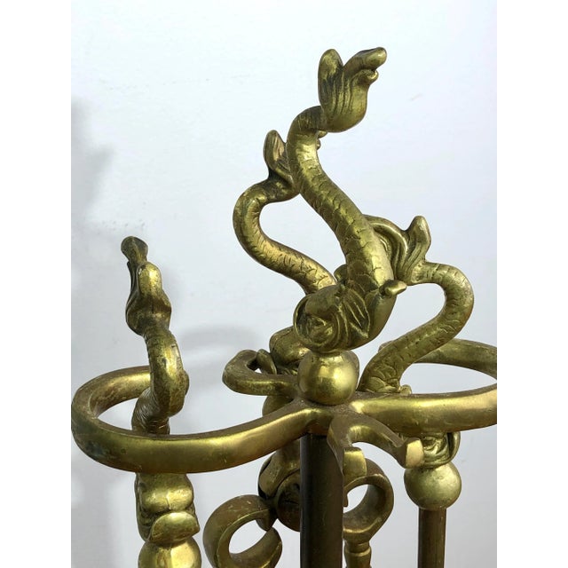 Dolphin Brass Fireplace Tool Set on a heavy Marble Base. Includes stand with tongs, shovel, and poker. No brush. Stand is...