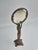 A figural vanity mirror in bronze, Art Nouveau early 1900s. Woman holding mirror with beautiful details. The glass is...