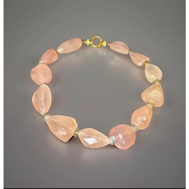 Huge 12 chunks of rose quartz gemstone, between 35-45mm. Large hand cut disc spacers of Labradorite 9mm. The entire...