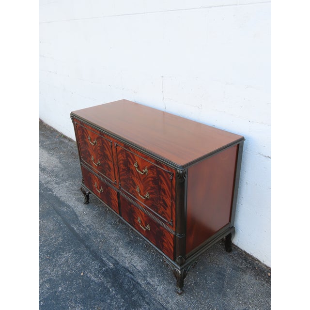 This magnificent Dresser is made of wood, mahogany, flame mahogany, veneer, and brass. This wonderful Dresser is an...