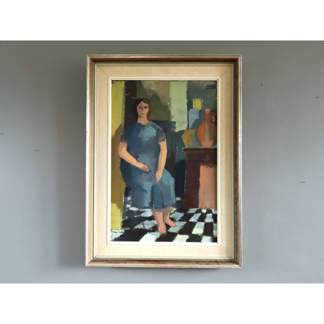 PRESENCE IN BLUE Size: 29.5 x 21.7 inches (including frame) Oil on canvas A mid-century figurative interior that presents...