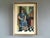 PRESENCE IN BLUE Size: 29.5 x 21.7 inches (including frame) Oil on canvas A mid-century figurative interior that presents...