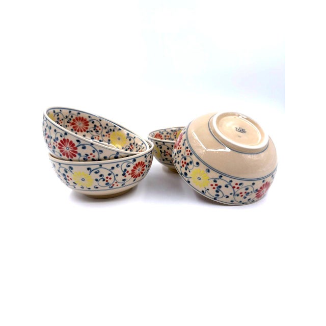 A beautiful set of four handcrafted ceramic soup bowls from Bat Trang, Vietnam, a village renowned for its centuries-old...