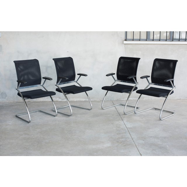 Ergonomic cantilever, eight chairs available. Black technical upholstery, chromed steel structure and armrests. Very...