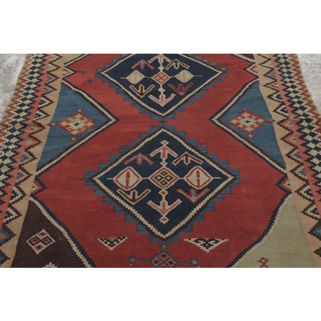 Hand-knotted in wool circa 1920–1940, this 5x8 antique tribal rug is a bold addition to Rug & Kilim’s collection. It...