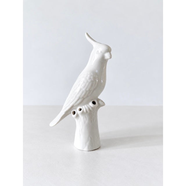 1960s blanc de chine white porcelain cockatoo figurine perched on a branch. This was possibly a used as a small vase or...