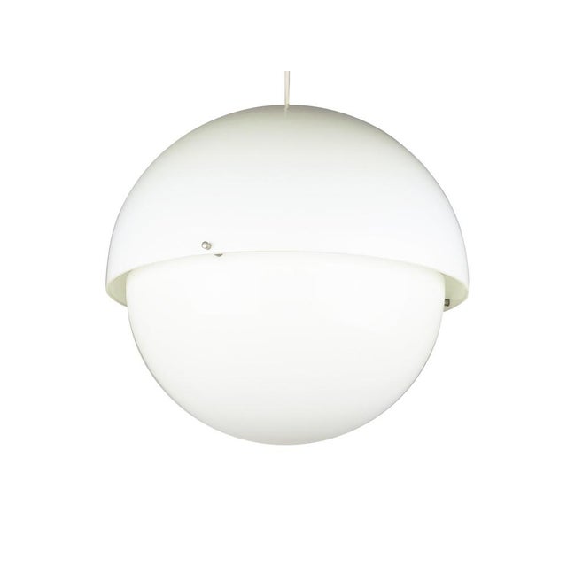 Pendant lamp composed by 2 methacrylate emispherical shades joined together with nickel plated brass screws. Electrical...