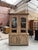 This very old two-section sideboard made of solid oak has been completely restored. It consists of an upper section with...