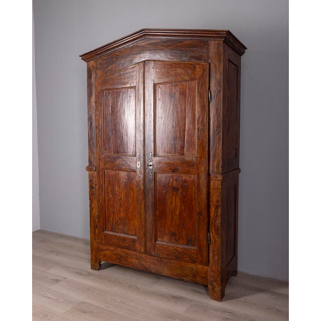 Piedmontese wardrobe, in brushed walnut wood with gable top, with two doors with lock and key, classic style, early 18th...