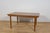 A rare model of a rectangular table with two mechanically opened extensions, made of teak wood by the British McIntosh...
