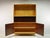 This elegant highboard is an original one-of-a-kind piece from the 1960s – a custom-made living room display cabinet "Made...