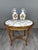An elegant pair of polychrome earthenware vases, baluster-shaped, adorned with a rich Renaissance-inspired design. The...