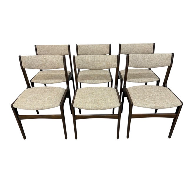 Elevate your dining space with this stunning set of six Mid-Century Danish Modern dining chairs, crafted in rich dark...