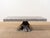 Handmade cocktail table Crafted from reinforced concrete in Waxed Gray Branch-like base and polished top Suitable for...