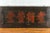 A large Chinese Qing Dynasty period black signboard from the 19th century, with red calligraphy. Created during the Qing...