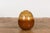 A Prem Collection ceramic artisan handcrafted two toned vase with brown, yellow and orange glaze and dripping motifs....