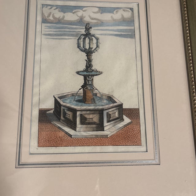 Beautifully framed and matted pair of colored Italian fountain engraving. 17th century. Elegantly colored primarily in...