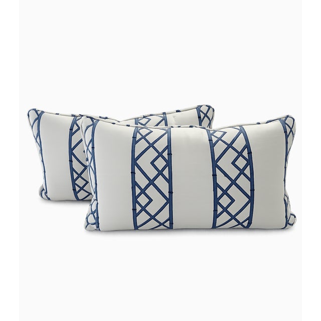A chic and timeless pair of lumbar pillows crafted in a classic Kravet bamboo lattice fabric in blue on an off-white...