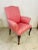 Fabulous pink upholstery with green trim! This traditional chair is transformed into a glamorous palm beach style piece,...