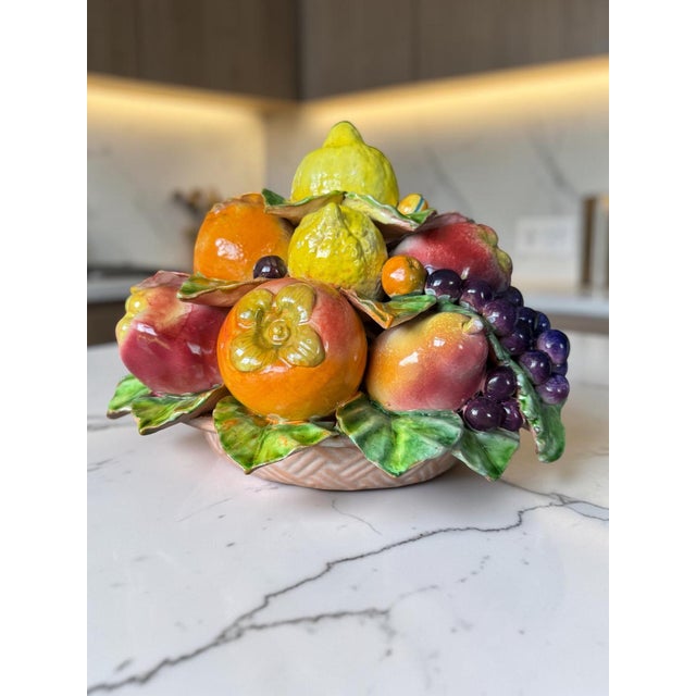 Bring the vibrant warmth of the Mediterranean into your home with this stunning vintage Italian Majolica ceramic fruit...