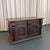 This antique, 19th century, artisan-made blanket chest trunk features an ornately hand-carved dark mahogany façade adorned...