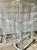 Elevate your space with this rare pair of 1980s Postmodern etageres. Attributed to Mirak. Featuring a unique tri-pole...