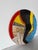 Exceptional hand-painted ceramic decorative plate by Lois Barton, created in the 1980s. This striking Modernist...