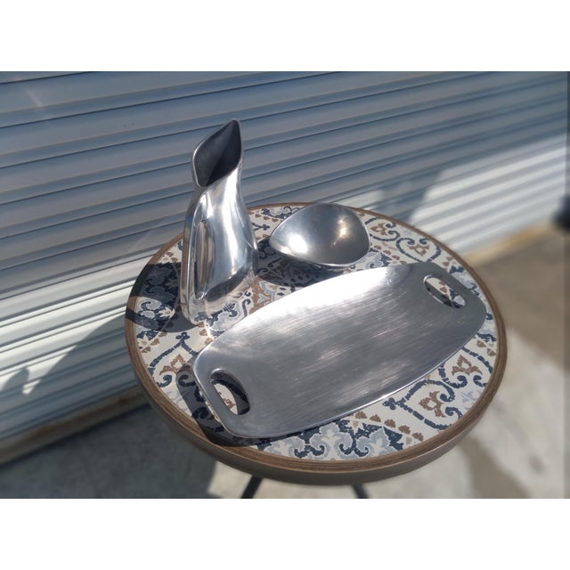 This is a beautiful pewter serving set. It consist of a serving tray, a pitcher and a bowl. The pieces are beautifully...