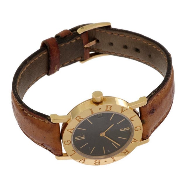 This is an authentic Bvlgari Engraved men's quartz wrist watch, the case and buckle is crafted from 18k yellow gold...